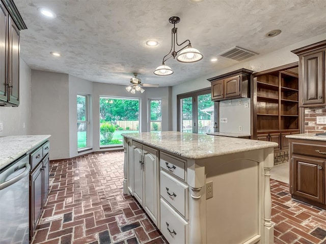 kitchen with visible vents, a ceiling fan, brick floor, and dishwasher