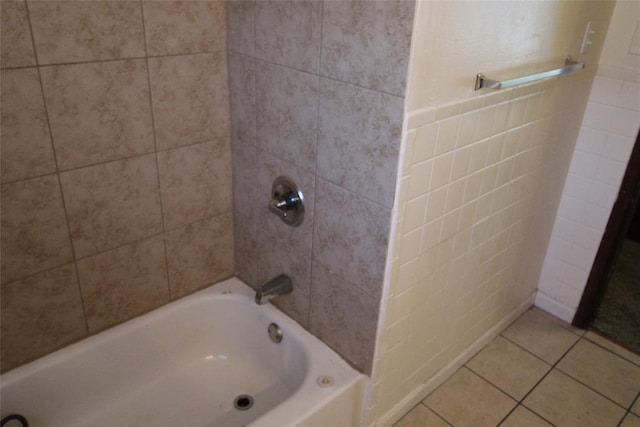 bathroom featuring shower / tub combination and tile patterned flooring