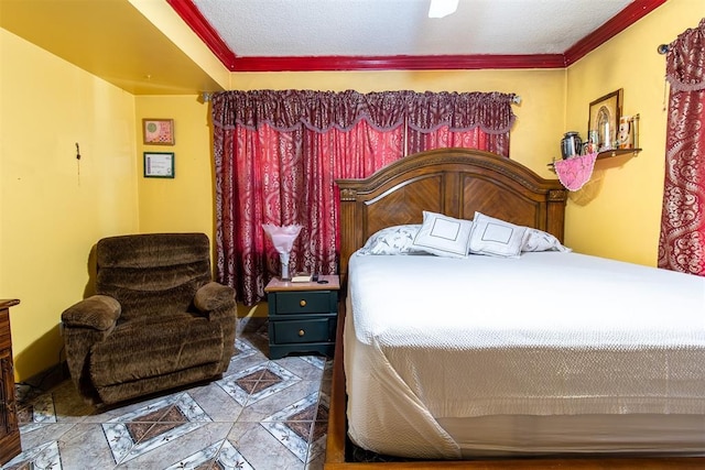 bedroom with a textured ceiling and ornamental molding