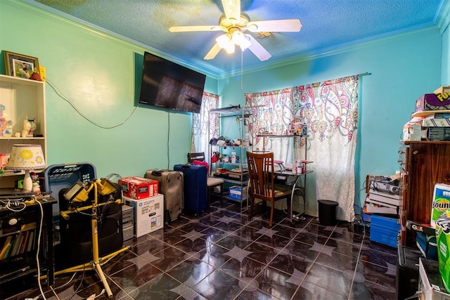 home office featuring a textured ceiling, ceiling fan, and crown molding