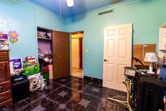 tiled office with a textured ceiling and ornamental molding