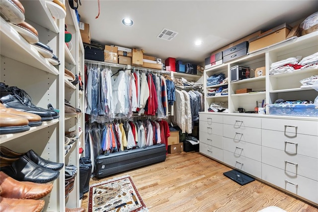 walk in closet featuring light hardwood / wood-style floors