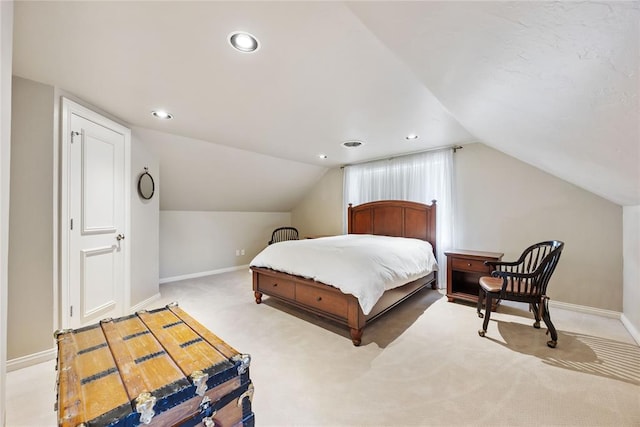 carpeted bedroom featuring vaulted ceiling