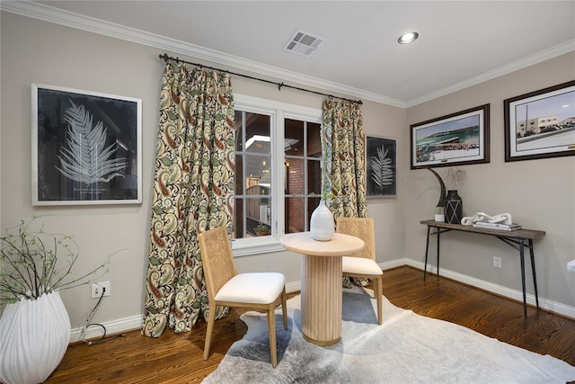 sitting room with crown molding, plenty of natural light, and dark hardwood / wood-style floors