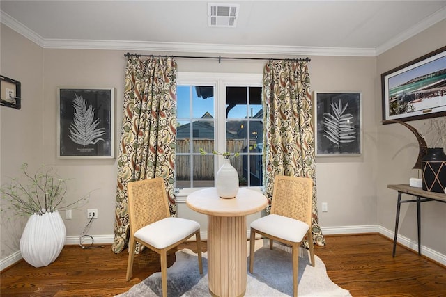 living area featuring dark hardwood / wood-style floors and ornamental molding