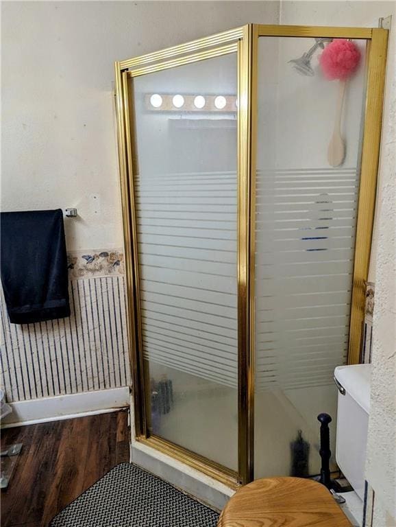 315 W Filmore St, Mangum, OK 73554 - full bathroom with toilet, a shower stall, and wood finished floors