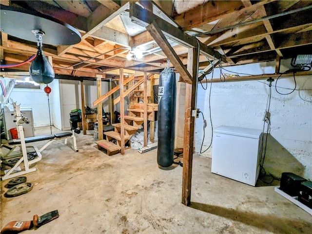 315 W Filmore St, Mangum, OK 73554 - unfinished basement featuring white refrigerator and stairway