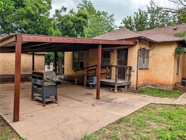 view of patio featuring a grill and a carport