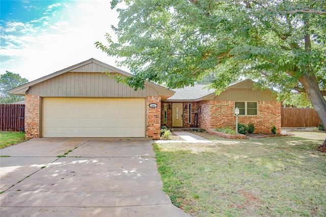 ranch-style home with a garage and a front lawn