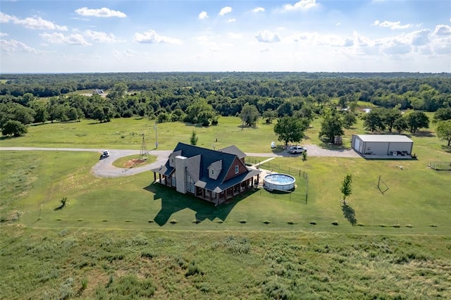 birds eye view of property with a rural view