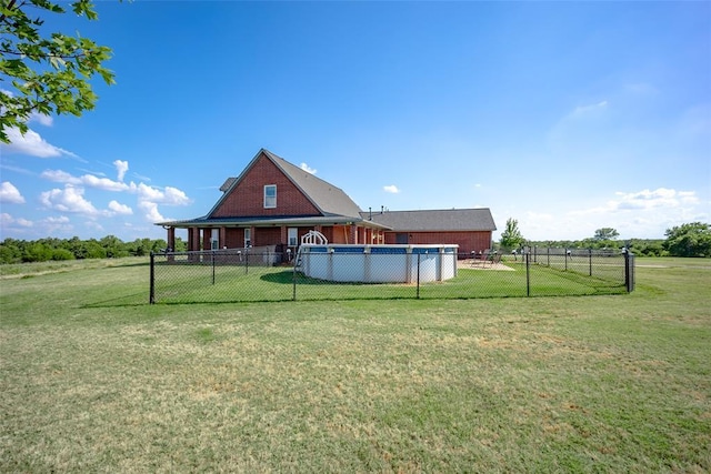 view of yard with a fenced in pool