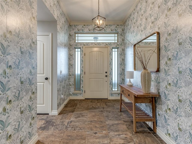 entrance foyer with ornamental molding, an inviting chandelier, and a healthy amount of sunlight