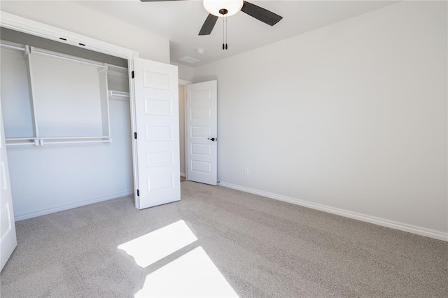 unfurnished bedroom with light carpet, a closet, and ceiling fan