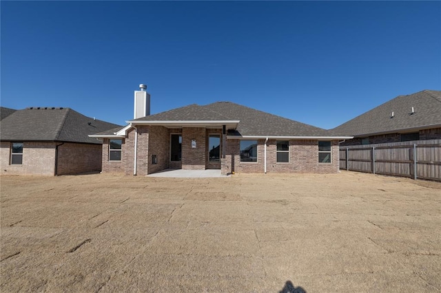 back of house with a patio area