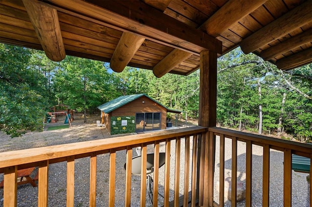 wooden deck with an outdoor structure