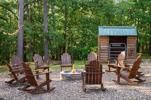 view of patio / terrace featuring an outdoor fire pit