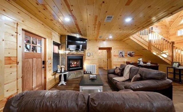 living room with wood walls, wood ceiling, and hardwood / wood-style flooring