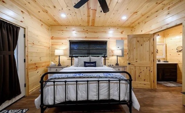 bedroom with ceiling fan, wood-type flooring, wood walls, and wooden ceiling