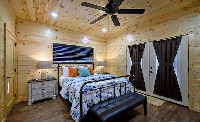 bedroom featuring wooden walls, dark hardwood / wood-style floors, ceiling fan, and wooden ceiling