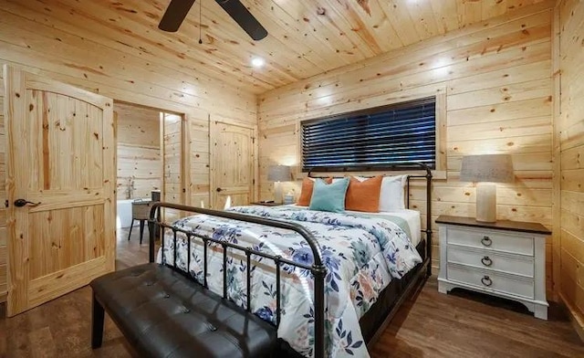 bedroom featuring wooden walls, ceiling fan, and dark wood-type flooring