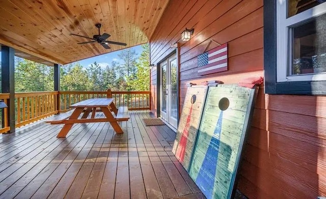 wooden terrace featuring ceiling fan