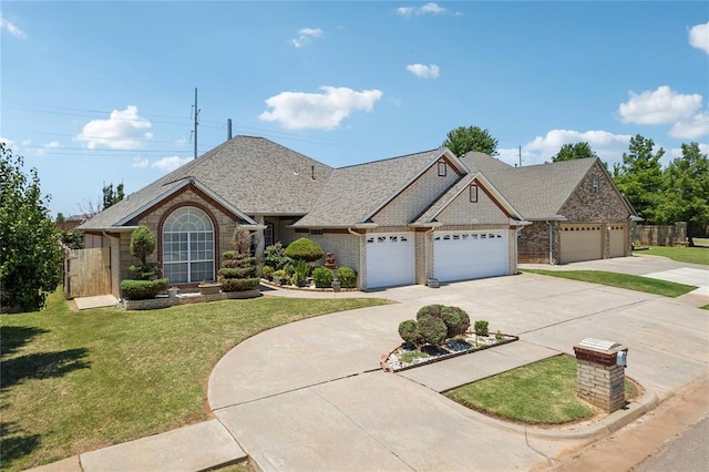 view of front of home with a front lawn and a garage