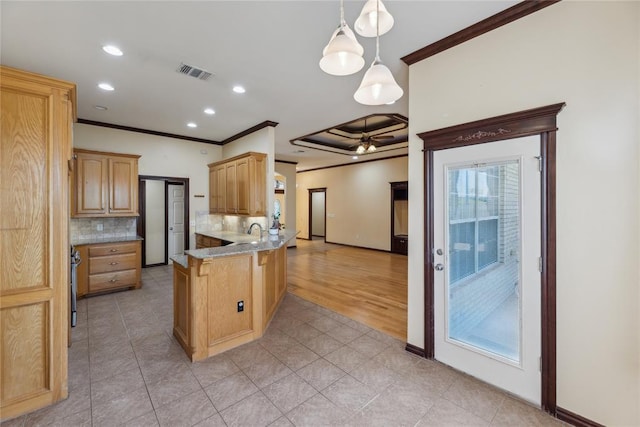 kitchen featuring kitchen peninsula, decorative backsplash, ornamental molding, light brown cabinets, and hanging light fixtures