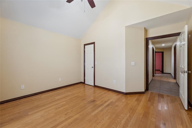 unfurnished room with high vaulted ceiling, light hardwood / wood-style flooring, and ceiling fan