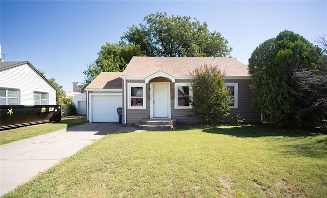 view of front of house with a front yard and a garage