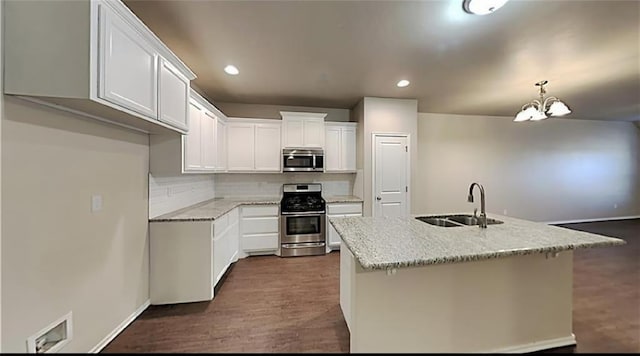 kitchen with sink, white cabinets, an island with sink, and appliances with stainless steel finishes