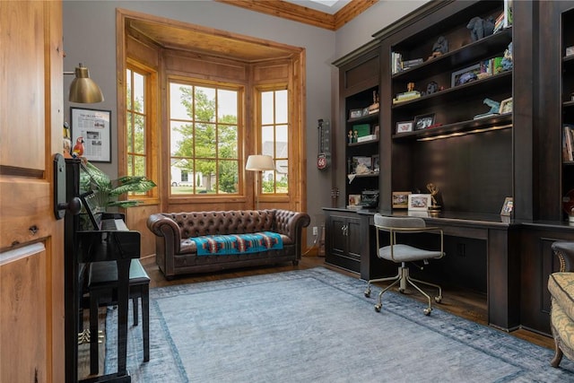 office space with wood walls, hardwood / wood-style floors, and ornamental molding