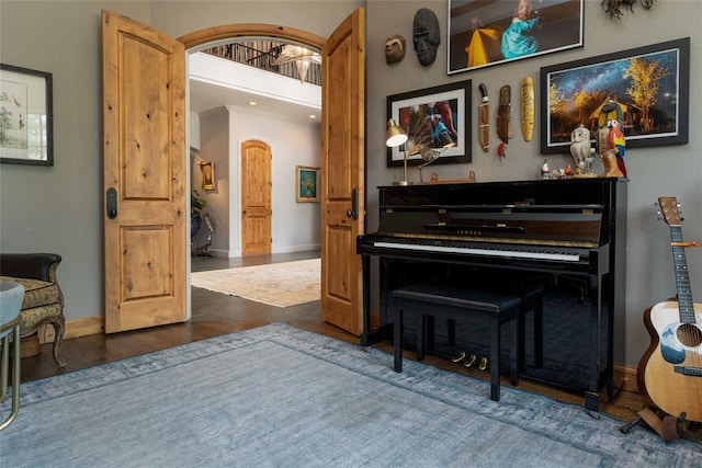 miscellaneous room with dark hardwood / wood-style floors and ornamental molding