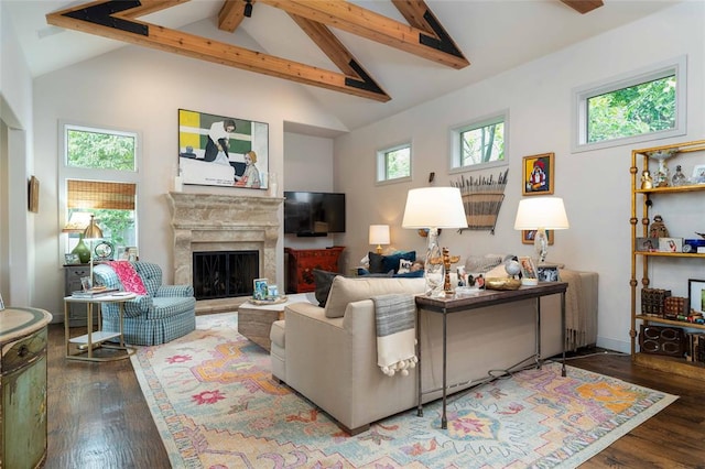 living room with ceiling fan, hardwood / wood-style floors, high vaulted ceiling, and beamed ceiling