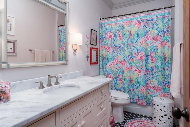 bathroom featuring tile patterned floors, vanity, toilet, and ornamental molding