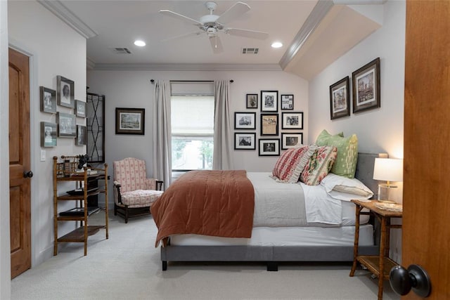 carpeted bedroom with ceiling fan and ornamental molding