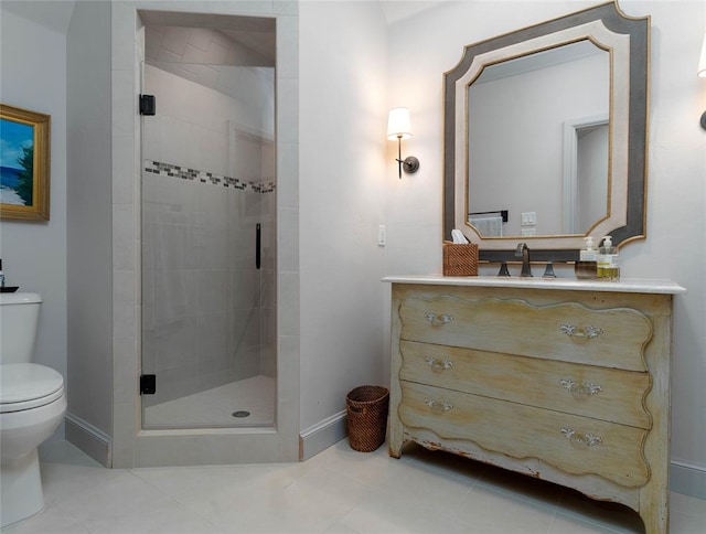 bathroom with an enclosed shower, vanity, toilet, and tile patterned floors