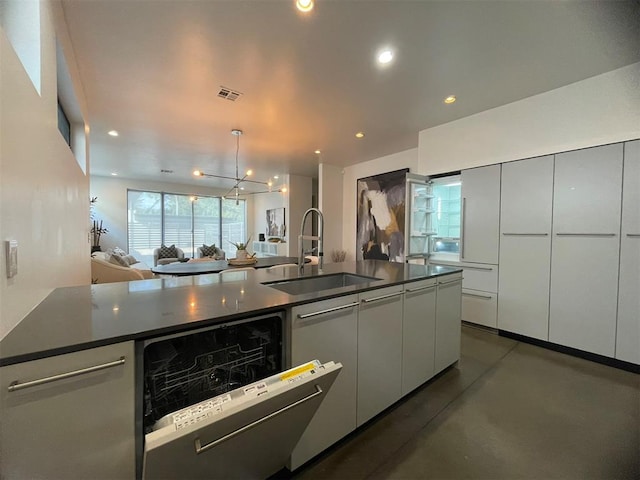 kitchen with a chandelier, sink, stainless steel dishwasher, and decorative light fixtures