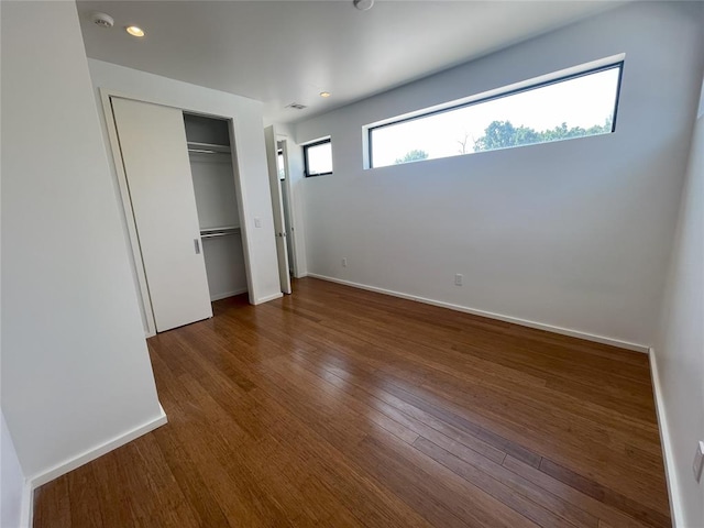 unfurnished bedroom featuring dark hardwood / wood-style floors