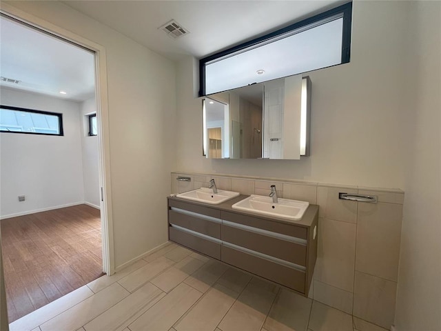 bathroom featuring vanity and hardwood / wood-style flooring