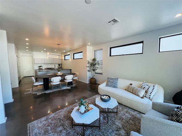 living room with a notable chandelier