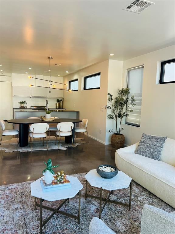 living room with concrete flooring