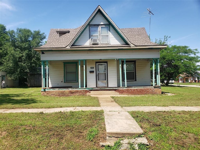 bungalow-style home with a porch and a front lawn