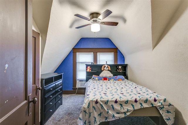 bedroom with dark colored carpet, vaulted ceiling, ceiling fan, and cooling unit