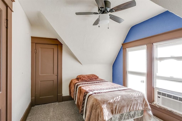 bedroom with carpet, ceiling fan, cooling unit, and vaulted ceiling