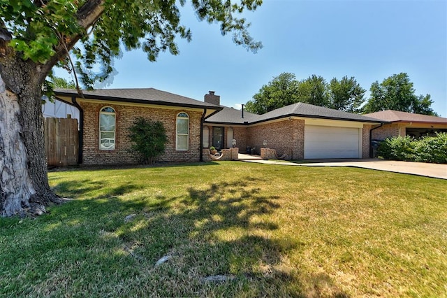 ranch-style house featuring a front lawn and a garage