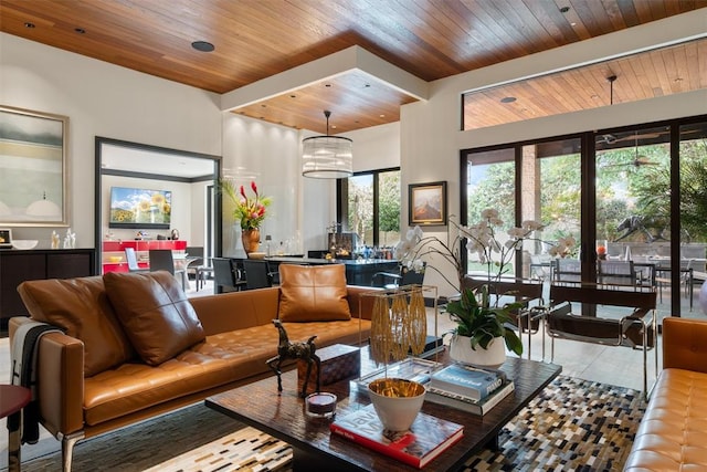 living room with wood ceiling and light tile patterned floors