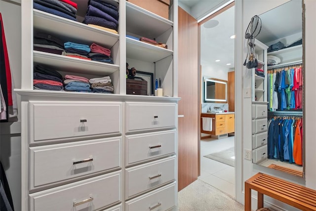 spacious closet with light tile patterned floors