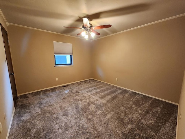 carpeted empty room with ceiling fan and ornamental molding