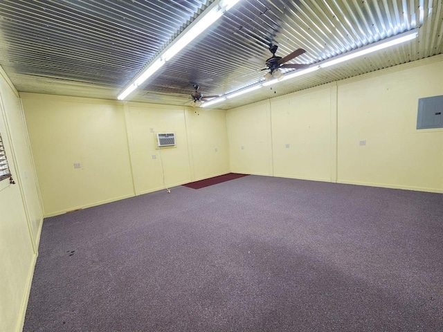 spare room featuring carpet, ceiling fan, and electric panel