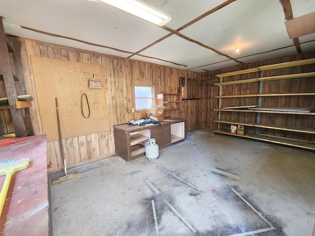 1116 Reid Cir, Seminole, OK 74868 - misc room with unfinished concrete flooring and wood walls
